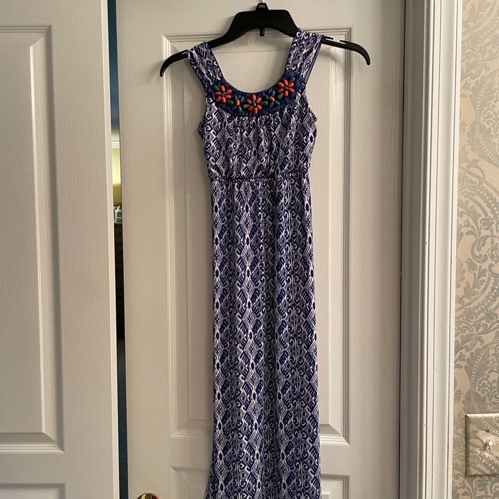 Trixxi Blue and White Maxi Dress with Floral Accents
Decorative beading